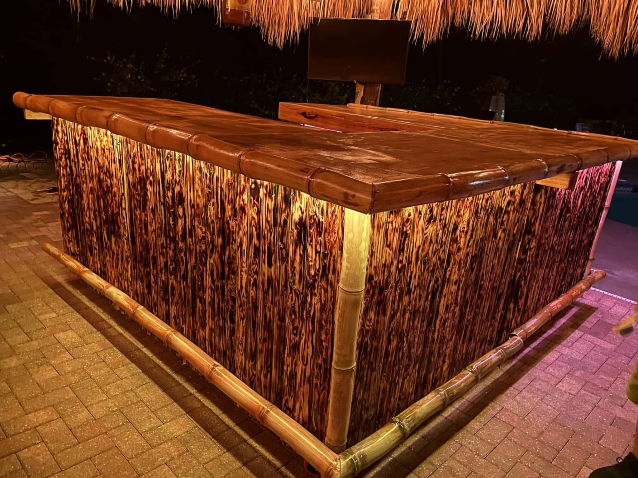 Tiki bar lit up at night time