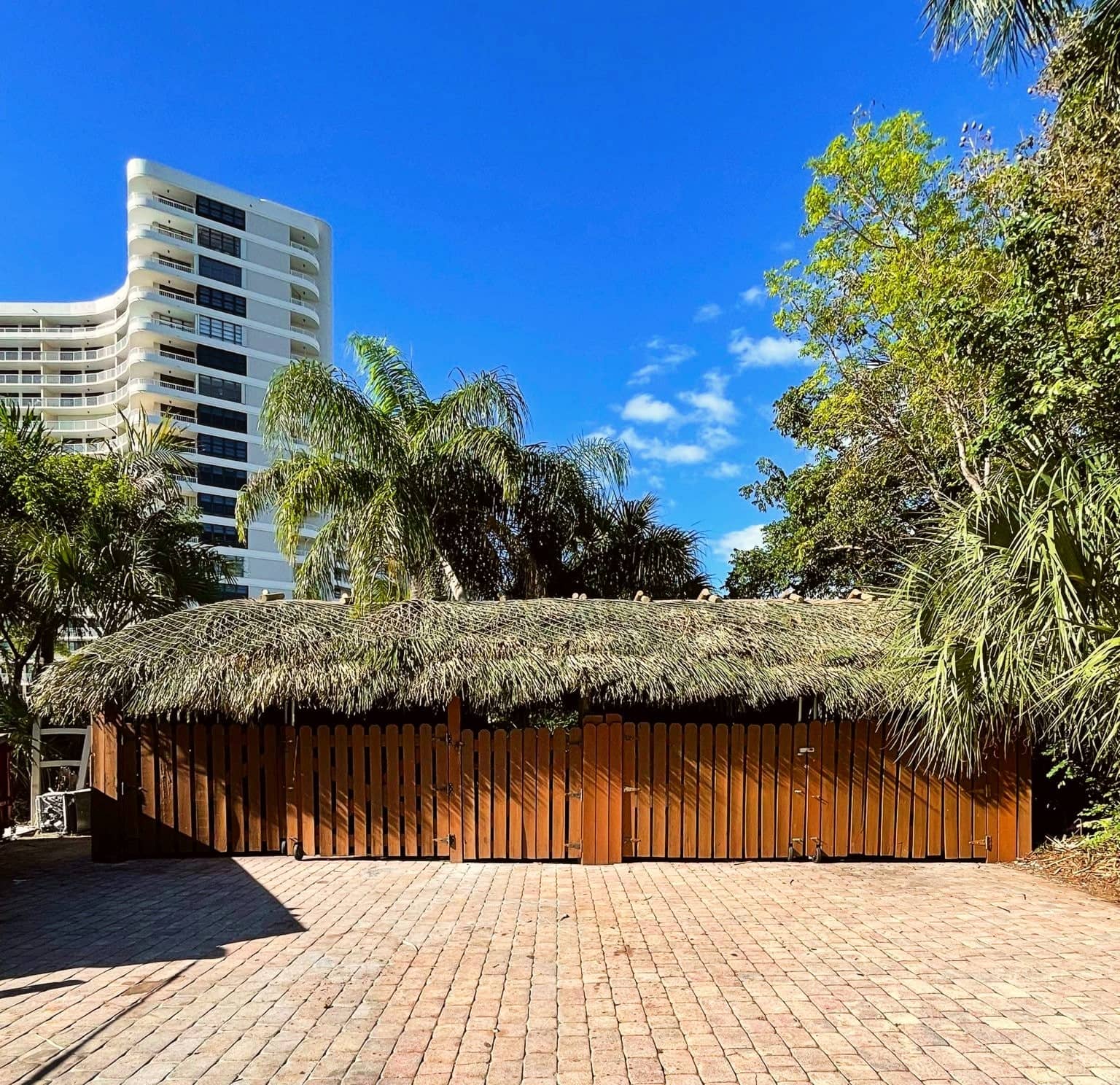 Trash bin area tiki with walls and doors