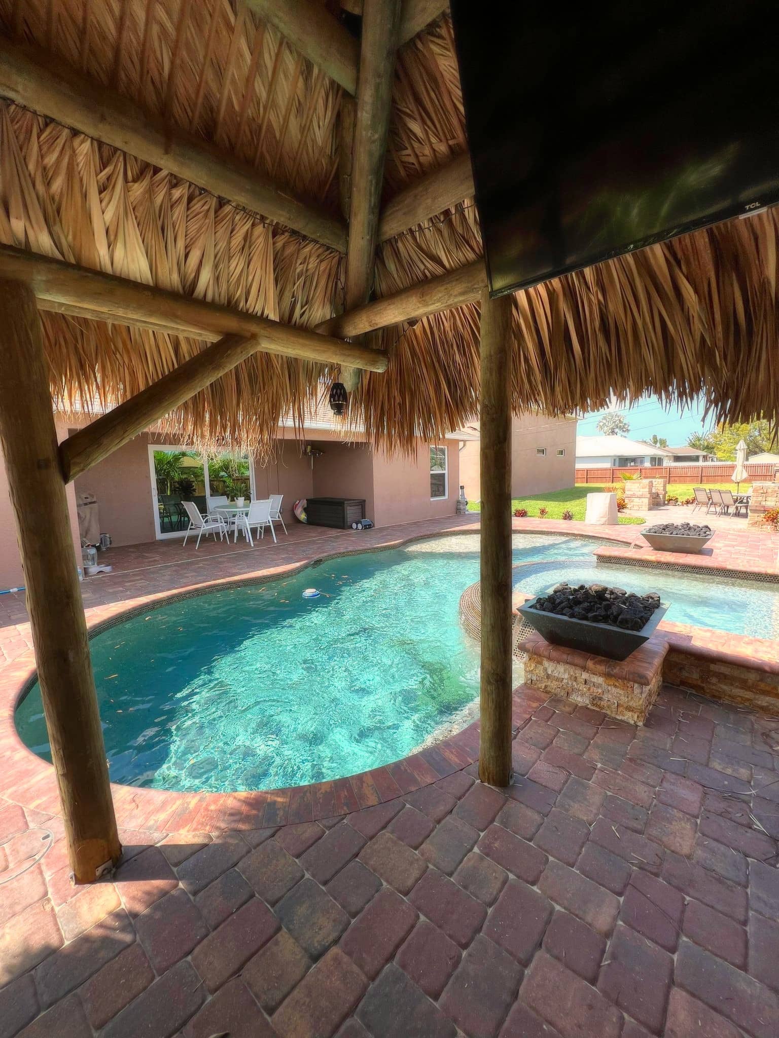 Tiki overlooking a pool